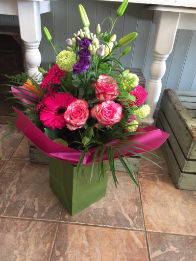 Deluxe Handtied - A stunning handtied arrangement in bold pinks alongside lush green foliage. This item is available for delivery by Hearts and Flowers in Cardiff and surrounding areas .
 
Fine Print: Every bouquet is hand made and delivered by the local florist. Pictures shown are recent examples of an actual arrangement that were designed by talented florists and later sent out to a customer just like you! Please note that each individual florist cannot guarantee what the flower varieties or colours will be, they do guarantee that your specific arrangement will be fresh, beautiful and that your recipient will love it! Deluxe Handtied - A stunning handtied arrangement in bold pinks alongside lush green foliage. This item is available for delivery by Hearts and Flowers in Cardiff and surrounding areas .
 
Fine Print: Every bouquet is hand made and delivered by the local florist. Pictures shown are recent examples of an actual arrangement that were designed by talented florists and later sent out to a customer just like you! Please note that each individual florist cannot guarantee what the flower varieties or colours will be, they do guarantee that your specific arrangement will be fresh, beautiful and that your recipient will love it!