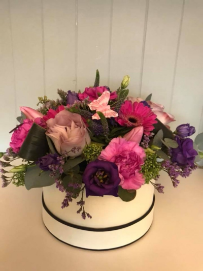 Simply The Best - Vibrant hat box arrangement in a lovely mix of colours. Available for delivery on Mother's day or another day of your choice. 
*Fine Print: Pictures shown are recent examples of an actual arrangement that we designed and later sent out to a customer just like you! Please note that while we don't guarantee what the flower varieties or colours will be, we do guarantee that your specific arrangement Simply The Best - Vibrant hat box arrangement in a lovely mix of colours. Available for delivery on Mother's day or another day of your choice. 
*Fine Print: Pictures shown are recent examples of an actual arrangement that we designed and later sent out to a customer just like you! Please note that while we don't guarantee what the flower varieties or colours will be, we do guarantee that your specific arrangement