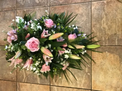 Pink Single Ended Spray - Single ended spray in oasis made in pink shades to include lillies and roses. At Hearts and Flowers we are delighted to present this product available for flower delivery in Cardiff and surrounding areas and surrounding areas. Pink Single Ended Spray - Single ended spray in oasis made in pink shades to include lillies and roses. At Hearts and Flowers we are delighted to present this product available for flower delivery in Cardiff and surrounding areas and surrounding areas.