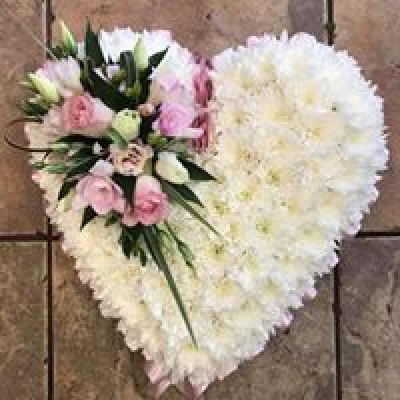 Funeral Based Closed Heart - Based white closed heart tribute, ribbon edging and flower cluster available in any colour of your choice red, orange, yellow, purple, pink etc. At Hearts and Flowers we are delighted to present this product available for flower delivery in Cardiff and surrounding areas Funeral Based Closed Heart - Based white closed heart tribute, ribbon edging and flower cluster available in any colour of your choice red, orange, yellow, purple, pink etc. At Hearts and Flowers we are delighted to present this product available for flower delivery in Cardiff and surrounding areas
