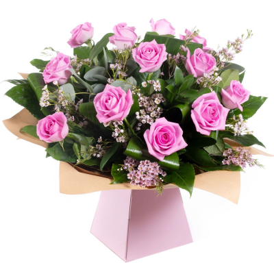 Dreamy Dozen - A hand-tied bouquet delivered in water of 12 high quality pink roses and complementary filler wrapped in paper/ cellophane in a box / bag. Dreamy Dozen - A hand-tied bouquet delivered in water of 12 high quality pink roses and complementary filler wrapped in paper/ cellophane in a box / bag.