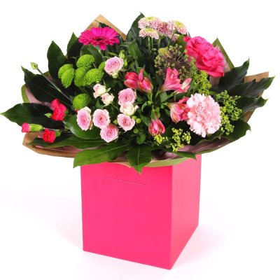 Blushing Meadow - A stunning collection of pink and green seasonal flowers in toning packaging. This bouquet is designed to impress and uplift any space. Blushing Meadow - A stunning collection of pink and green seasonal flowers in toning packaging. This bouquet is designed to impress and uplift any space.